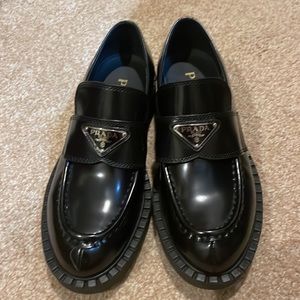 A copy- Prada Chocolate Brushed Leather Loafers in Black.